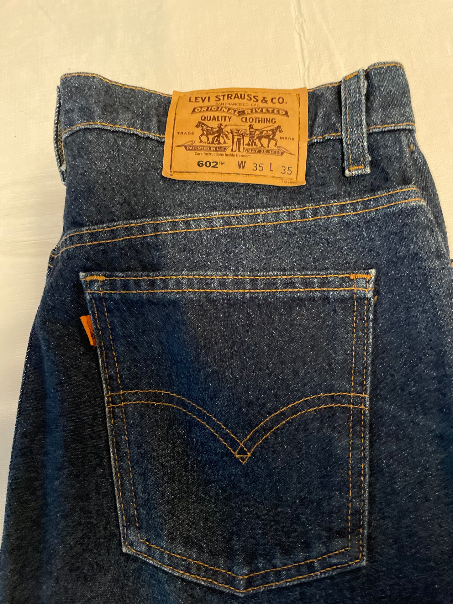 Orange tab Levi 602 - 34” x 29”