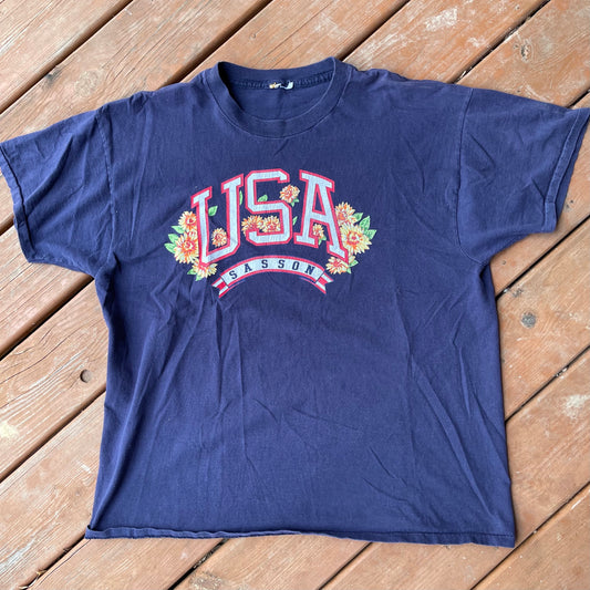 La camiseta Usa sasson se ajusta como XL 